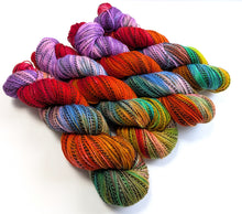 Load image into Gallery viewer, Frankenskein's Rainbow on high twist superwash merino/nylon "Zebra" sock yarn.
