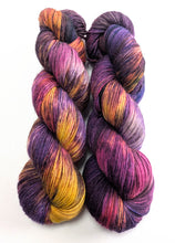 Load image into Gallery viewer, Two skeins of multicolored yarn on a white background
