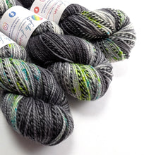 Load image into Gallery viewer, Three skeins of gray and green yarn with labels on a white background
