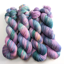 Load image into Gallery viewer, Multicolored yarn skeins on a white background
