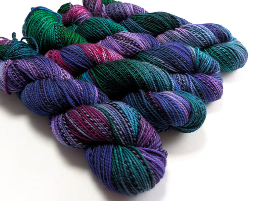 Multicolored yarn skeins on a white background