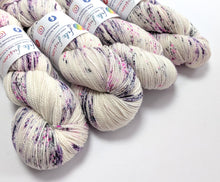 Load image into Gallery viewer, Gothic Speckles on a superwash Merino/nylon/sparkle sock yarn.
