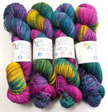 Load image into Gallery viewer, Colorful yarn skeins with visible branding on a white background
