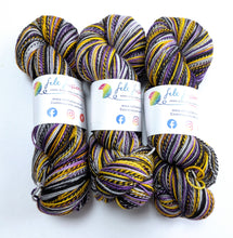 Load image into Gallery viewer, Three skeins of multicolored yarn with labels on a white background
