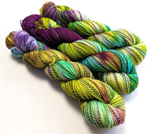 Load image into Gallery viewer, Colorful skeins of yarn on a white background
