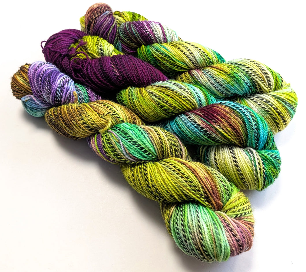 Colorful skeins of yarn on a white background