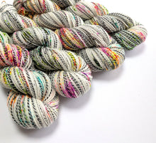 Load image into Gallery viewer, Murder on the Dancefloor on high twist superwash merino/nylon "Zebra" sock yarn.
