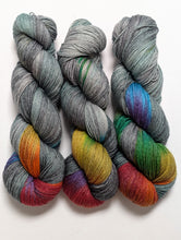Load image into Gallery viewer, Dark Winter Rainbow on superwash merino/bamboo 4ply/fingering weight.
