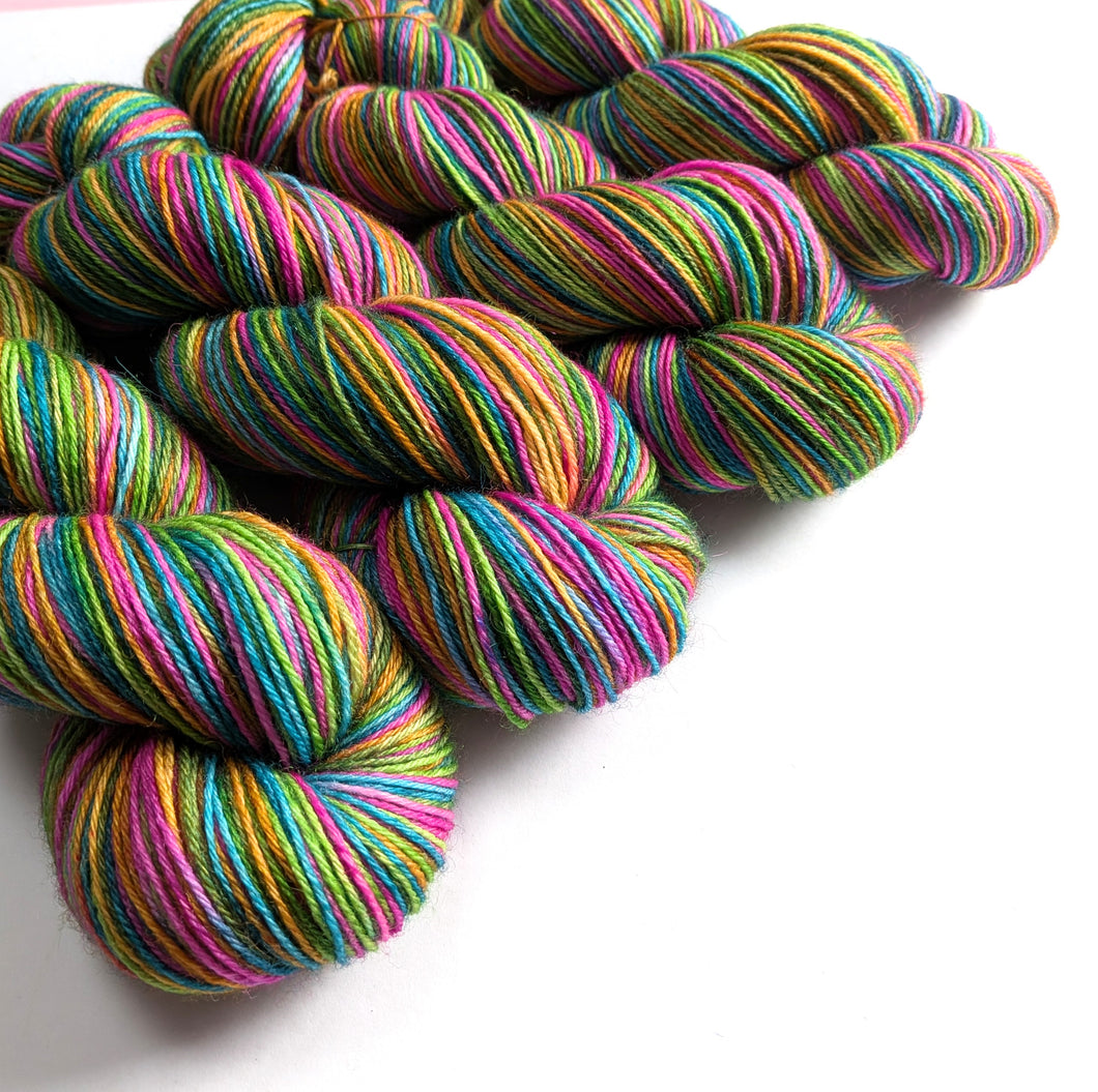 Multicolored yarn skeins on a white background
