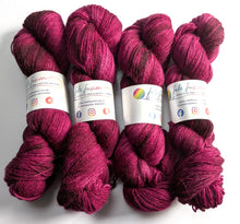 Load image into Gallery viewer, Four skeins of deep red yarn with labels on a white background
