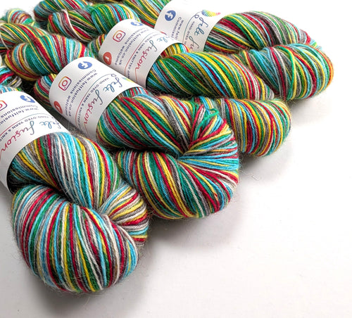 Colorful skeins of yarn with labels on a white background