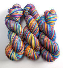Load image into Gallery viewer, Colourful skeins of yarn on a white background
