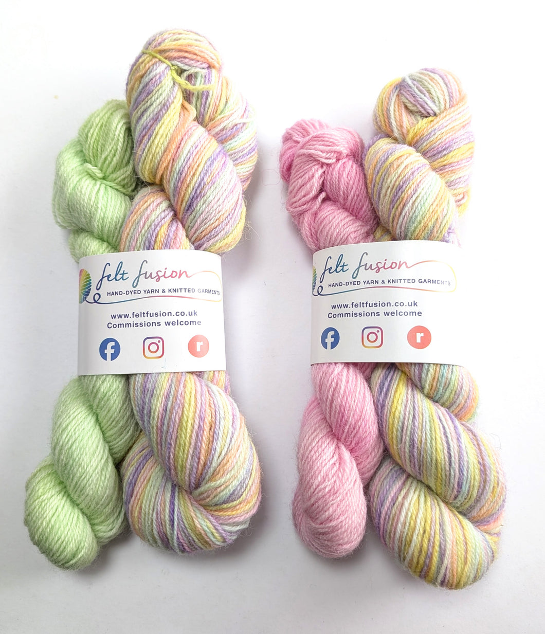 Two sets of multicolored pastel yarn on a white background