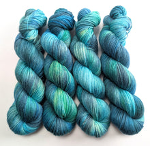 Load image into Gallery viewer, Blue and green yarn skeins on a white background
