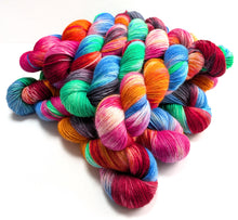 Load image into Gallery viewer, Multicolored skeins of yarn on a white background
