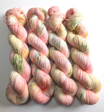 Load image into Gallery viewer, Four skeins of multicolored yarn on a white background
