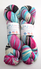 Load image into Gallery viewer, Two skeins of multicolored yarn with Felt Fusion labels on a white background
