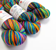 Load image into Gallery viewer, Wintertime Rainbow on superwash merino/cashmere/nylon DK yarn.
