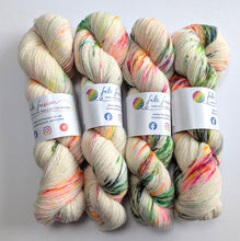 Load image into Gallery viewer, Four skeins of multicolored yarn with visible brand labels on a white background

