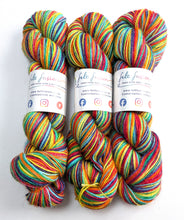 Load image into Gallery viewer, Three skeins of colorful yarn with visible brand labels on a white background

