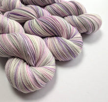 Load image into Gallery viewer, Multicolored yarn skeins on a white background
