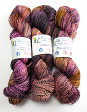 Load image into Gallery viewer, Three skeins of multicolored yarn with labels on a white background
