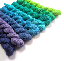 Load image into Gallery viewer, Set of yarn skeins in blue, green, and purple on a white background
