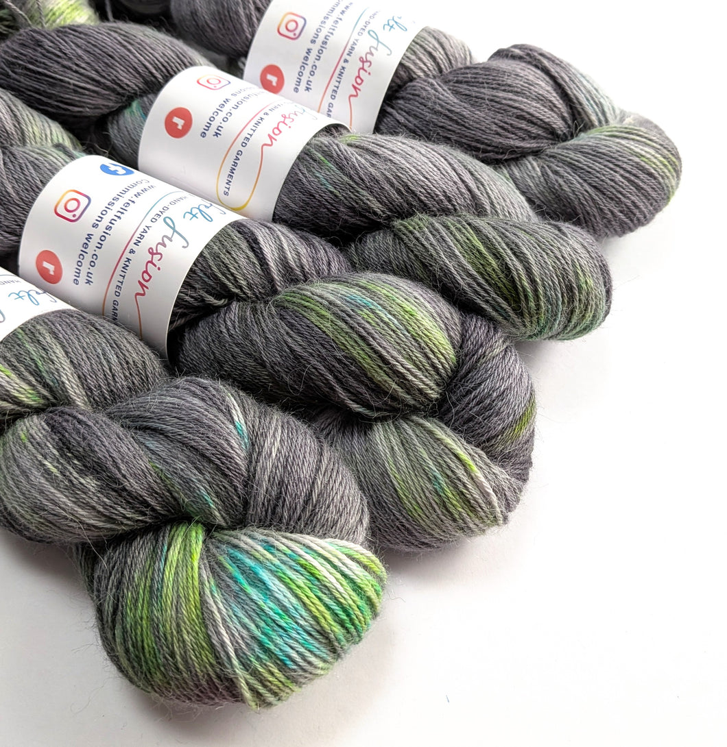 Gray and green yarn skeins with labels on a white background
