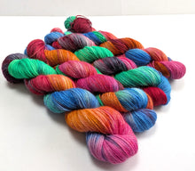 Load image into Gallery viewer, Multicolored yarn skeins on a white background
