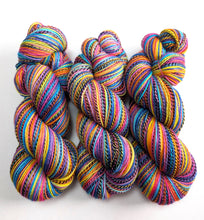 Load image into Gallery viewer, Three skeins of multicoloured yarn.

