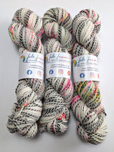 Load image into Gallery viewer, Three skeins of multicolored yarn with visible branding on a white background
