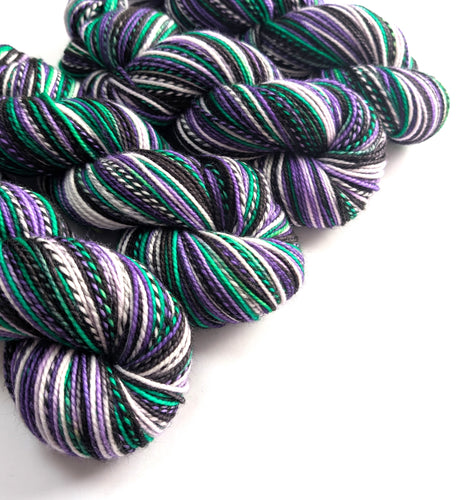Multicolored yarn skeins on a white background