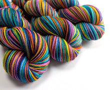 Load image into Gallery viewer, Colorful skeins of yarn on a white background
