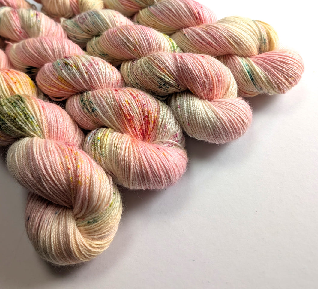 Multicoloured yarn skeins on a white background