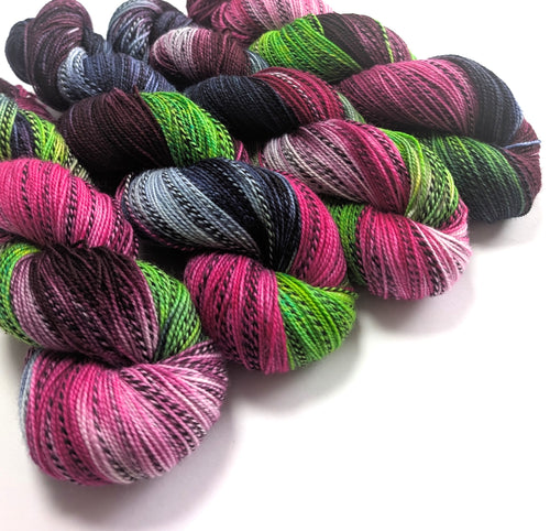 Multicolored yarn skeins on a white background