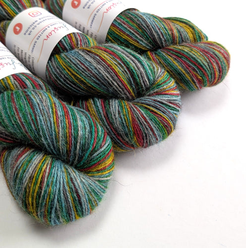 Multicolored yarn skeins on a white background