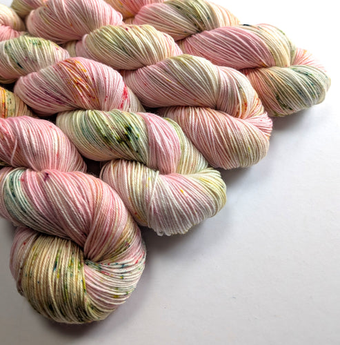 Multicoloured yarn skeins on a white background
