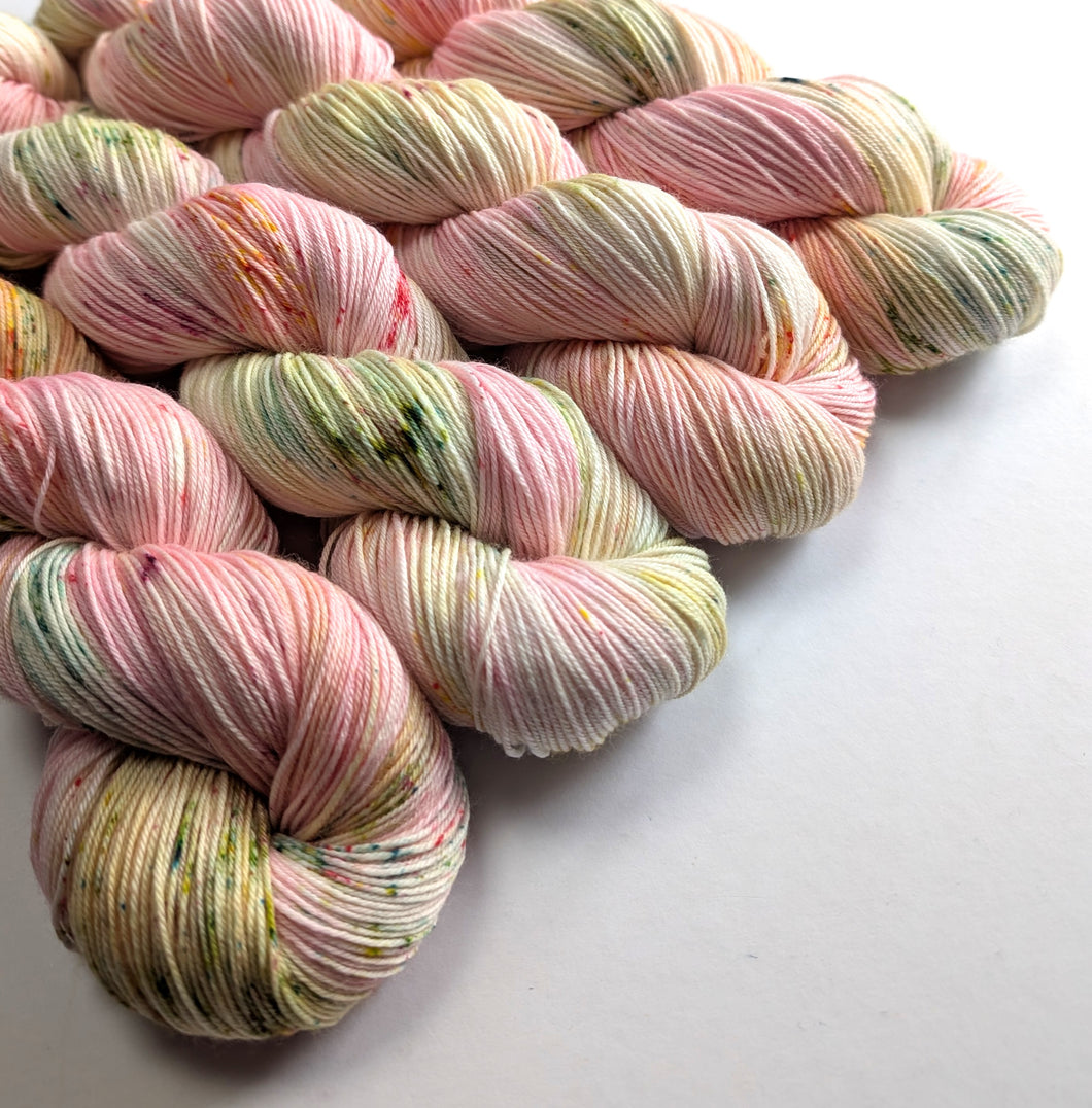 Multicoloured yarn skeins on a white background