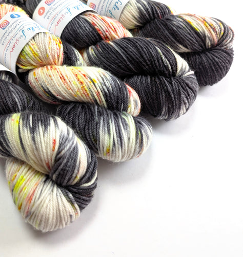  skeins of multicoloured yarn on a white background