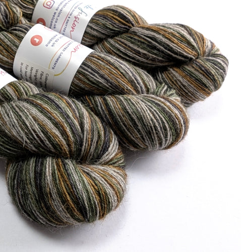 skeins of multicolored yarn with labels on a white background