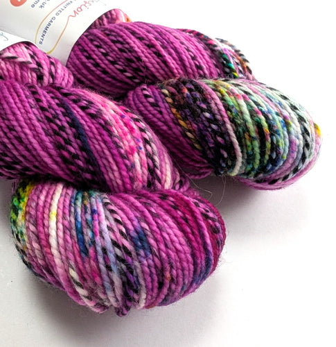 Multicolored yarn skeins on a white background