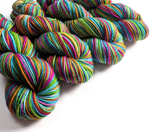 Colorful skeins of yarn on a white background