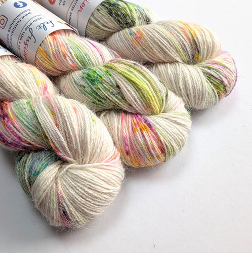 Multicolored yarn skeins on a white background
