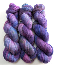 Load image into Gallery viewer, Three skeins of purple and blue yarn on a white background
