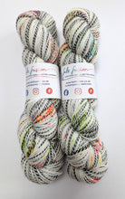 Load image into Gallery viewer, Murder On The Dancefloor on high twist superwash merino/nylon "Zebra" sock yarn.
