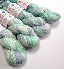 Load image into Gallery viewer, Sea Foam on 100% llama 4ply/fingering weight yarn.
