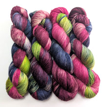 Load image into Gallery viewer, Multicolored yarn skeins on a white background
