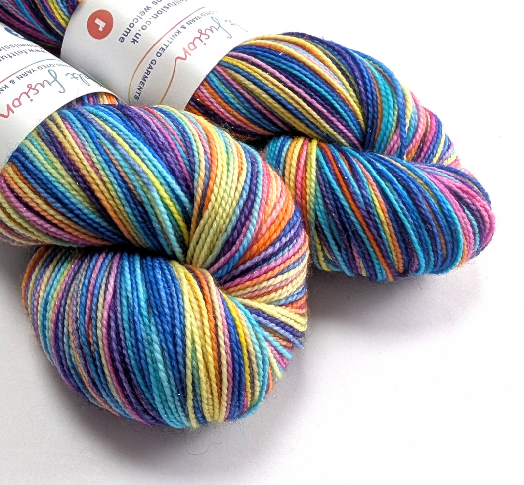 Multicolored skein of yarn with a label on a white background