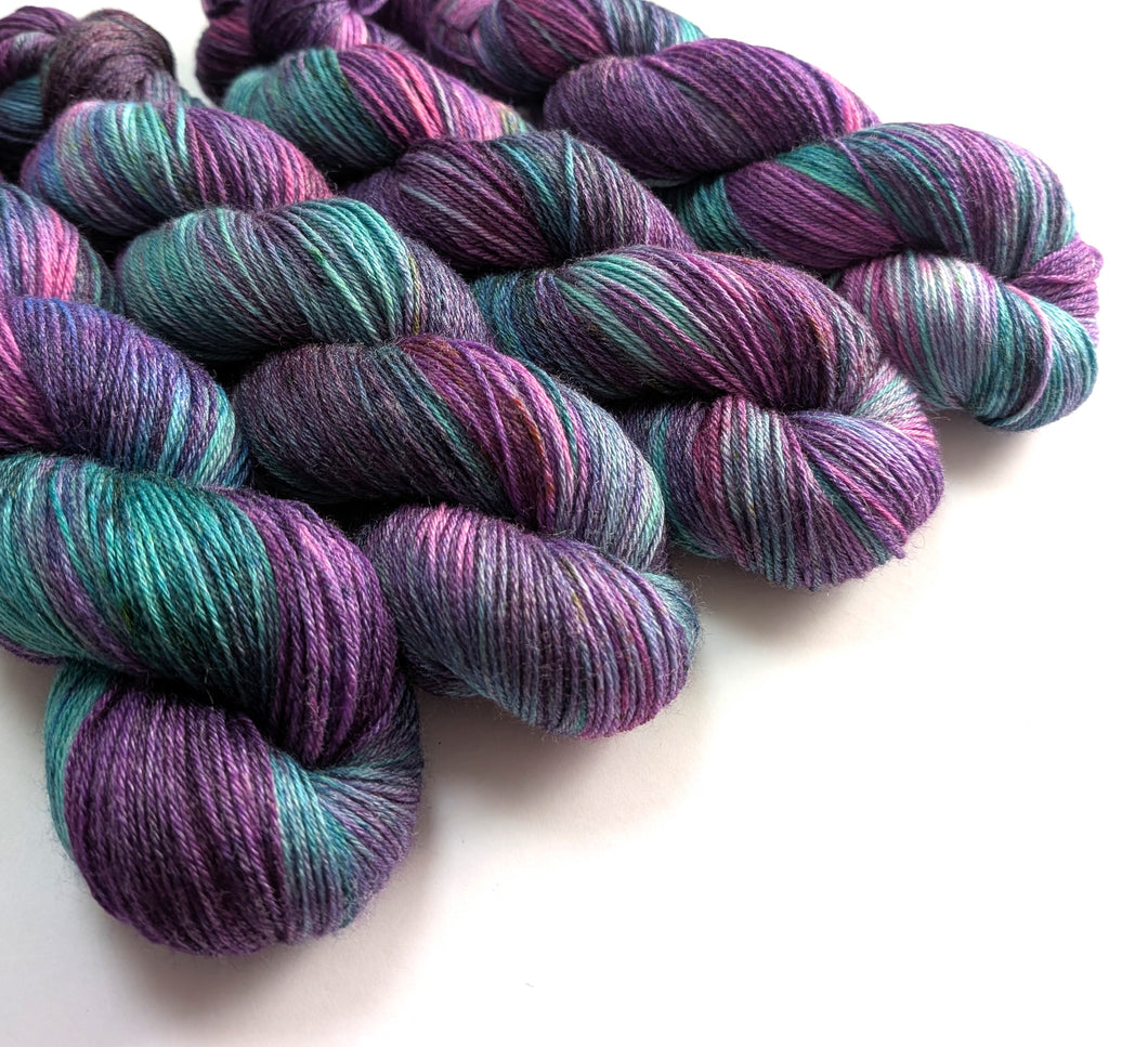 Multicolored yarn skeins on a white background