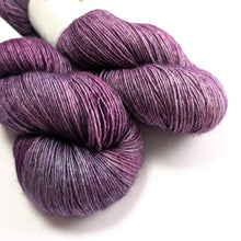 Load image into Gallery viewer, Two skeins of purple yarn on a white background.

